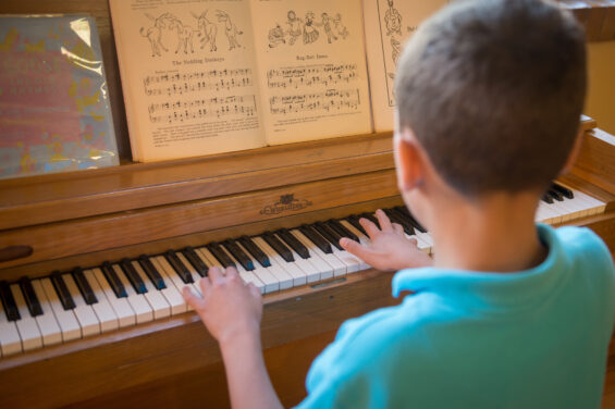 Young child playing the piano