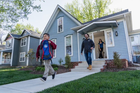 Family walking out of their new home in Kansas