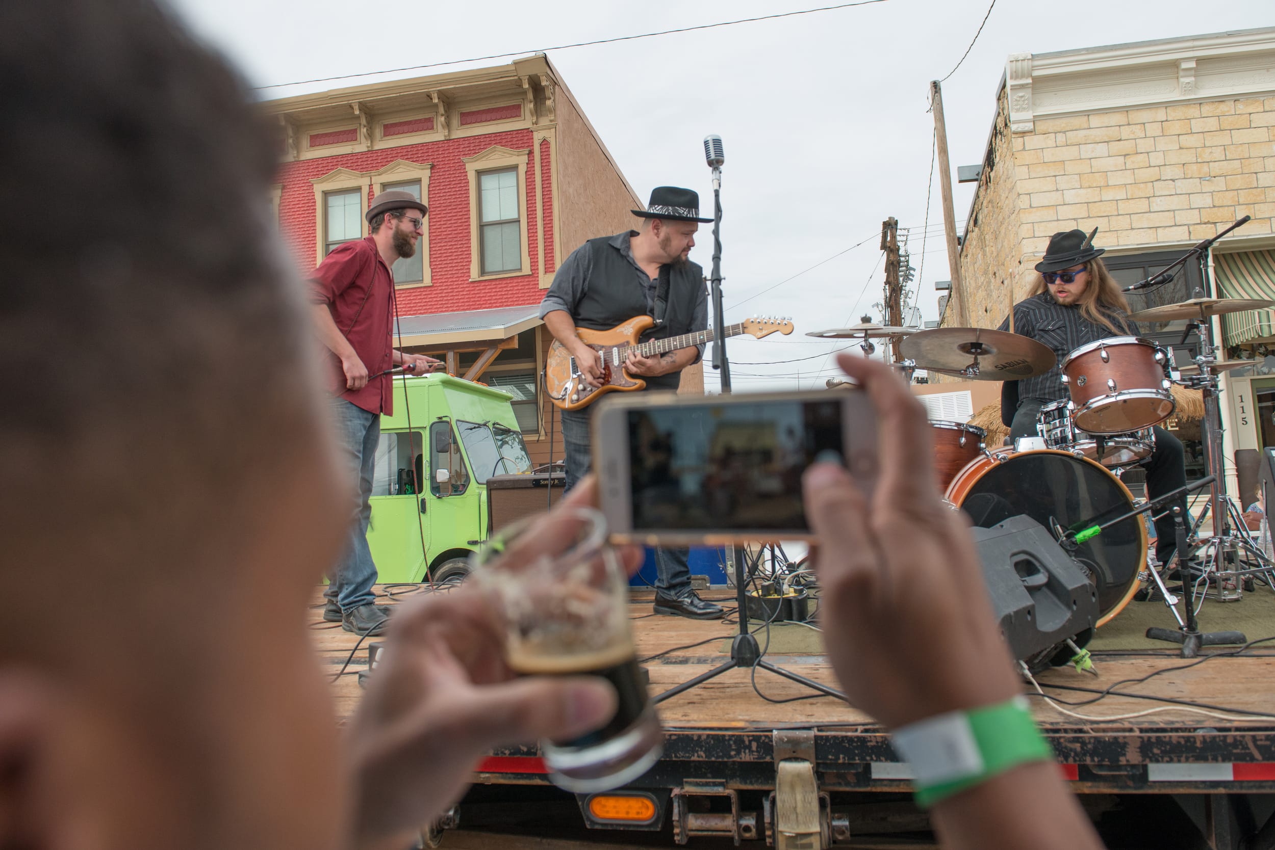A man recording performers at a Kansas music festival