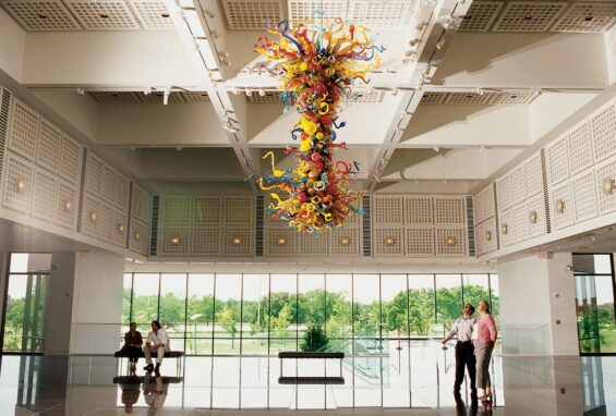 Colorful Chihuly glass chandelier hanging in the modern lobby of the Wichita Art Museum.