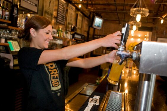 Bartender pouring a craft beer.