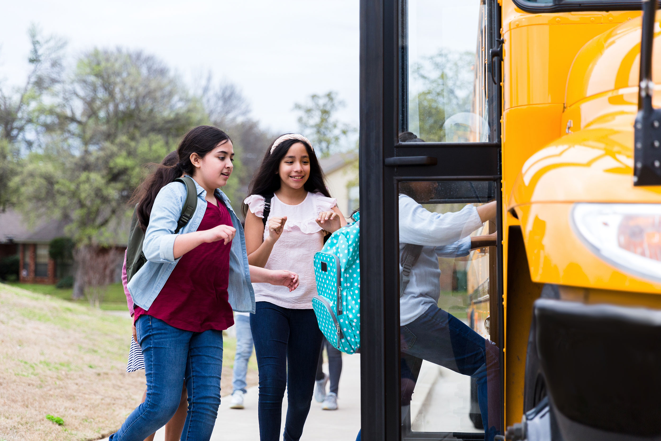 Elementary School students board a school bus in Kansas